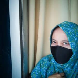 asian muslim woman wearing hijab and face mask in outdoor